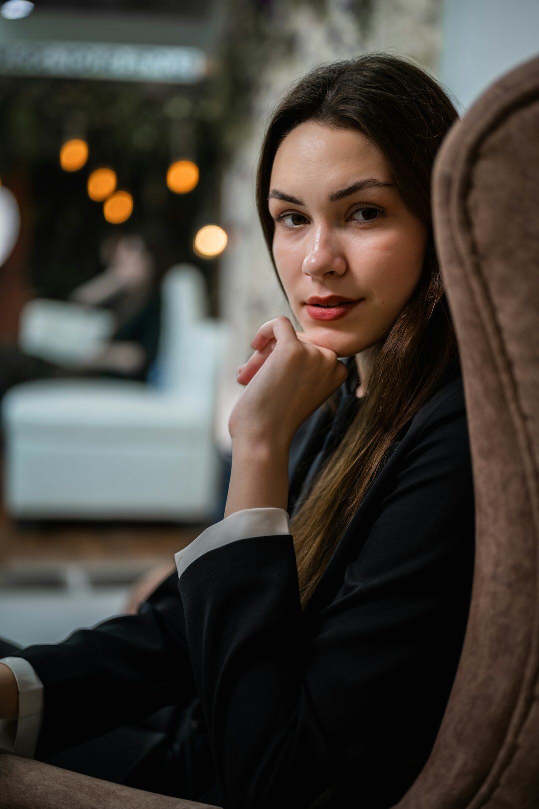 Studio portrait of a smiling young European woman consultant