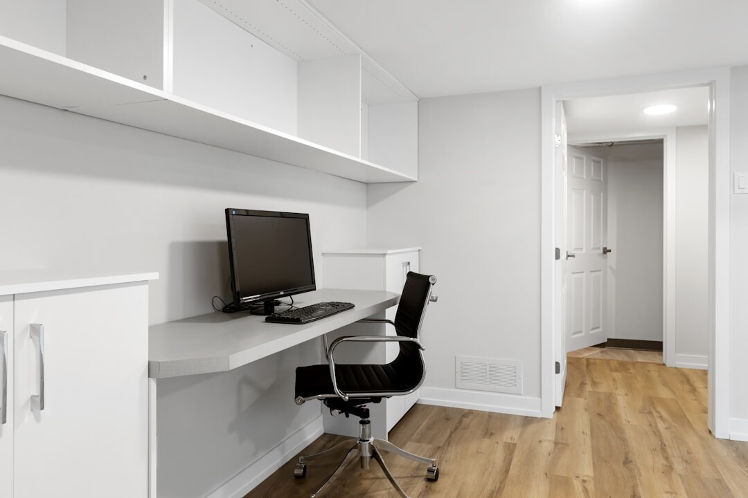 Bright modern office reception area with plants and seating